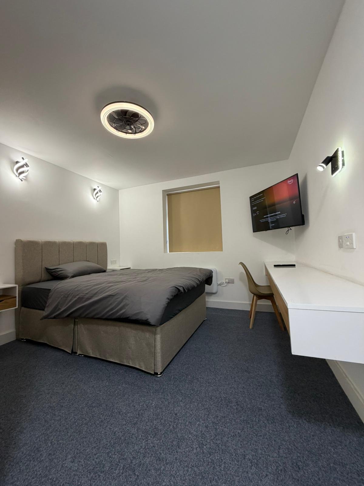 A calm shared living room in supported accommodation